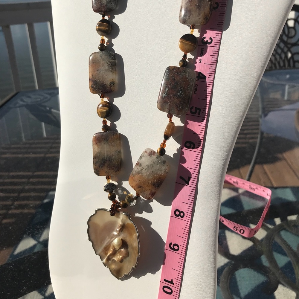 Handmade brown beaded necklace with shell pendant